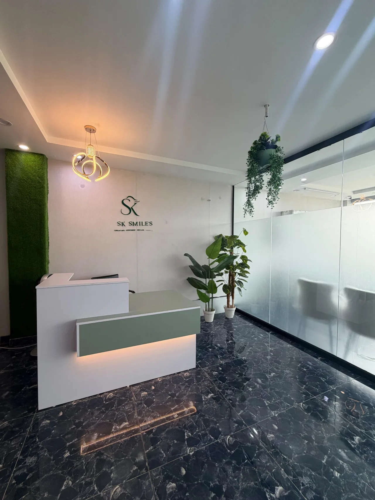 Reception desk and seating area at SK SMILES